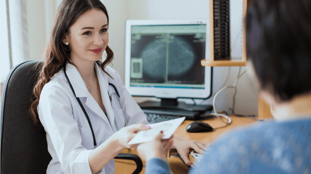 doctor handing a disk to a patient