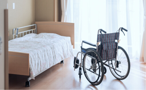 wheelchair next to hospital bed